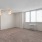 a room with a window and ceiling fan